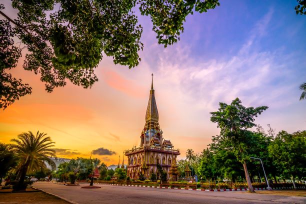 Pagoda in wat chalong or chalong temple with twilight