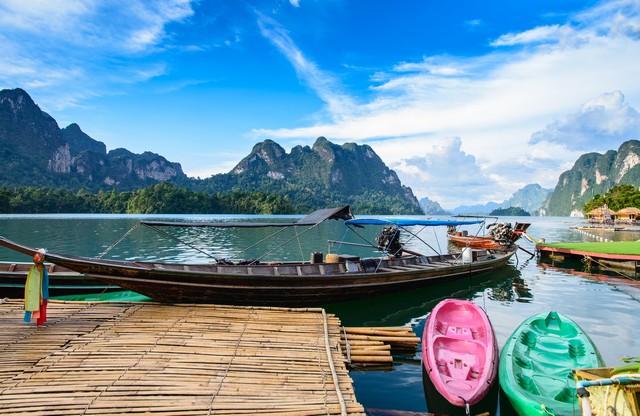 Long tail boat, a main transportation in Ratchaprapha Dam at Khao Sok National Park, Surat Thani Province, Thailand. Beautiful mountains and natural attractions. Kayaking, Recreation