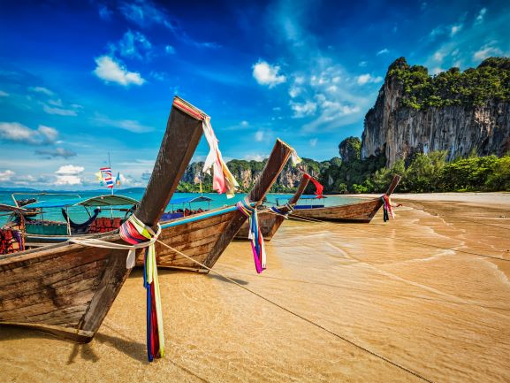 Long tail boats on tropical beach